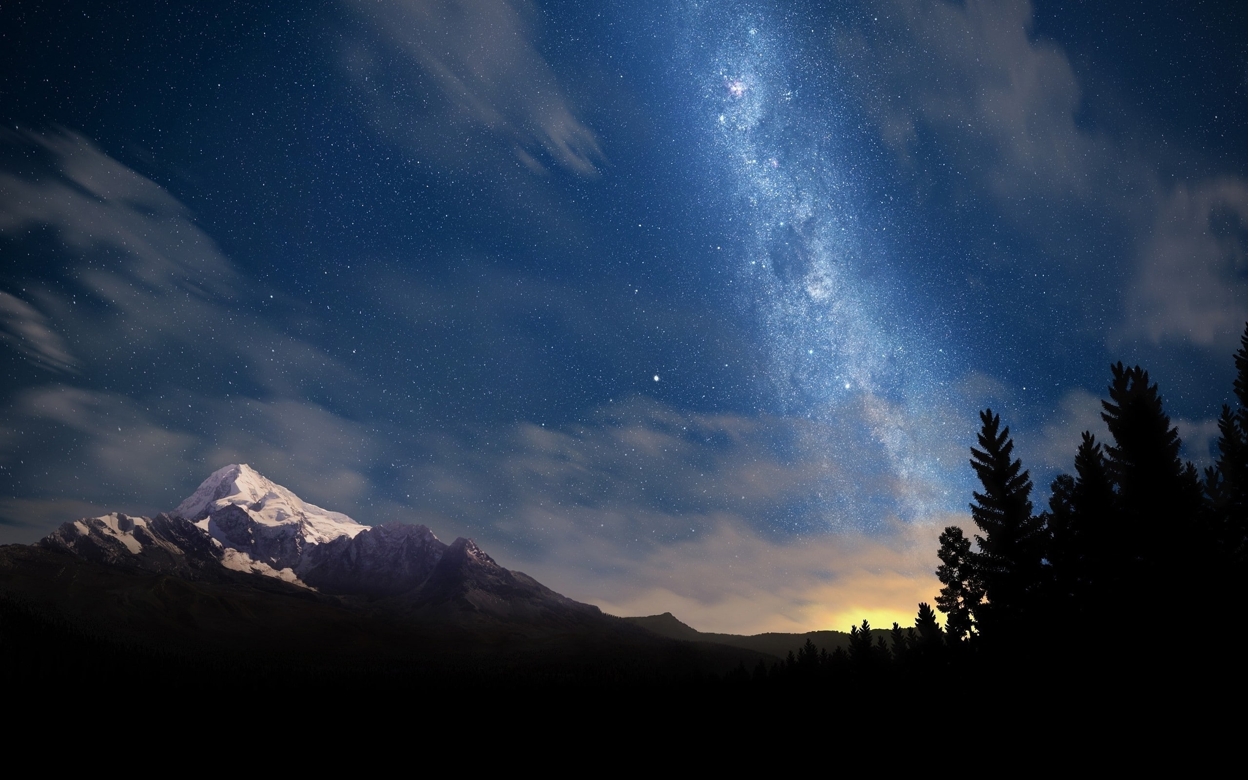 Snowcaps Mountains with milkyway glaxy visible on the sky